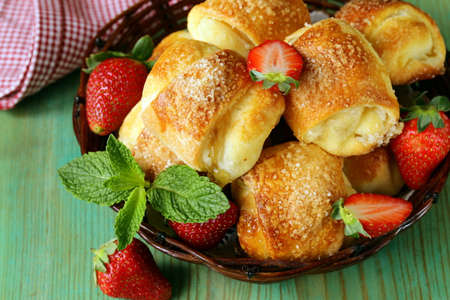 sweet muffins with strawberries and sugar - homemade pastriesの写真素材
