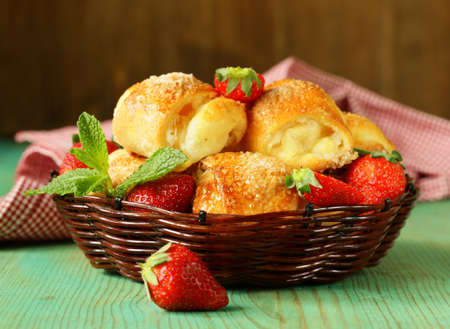sweet muffins with strawberries and sugar - homemade pastriesの写真素材