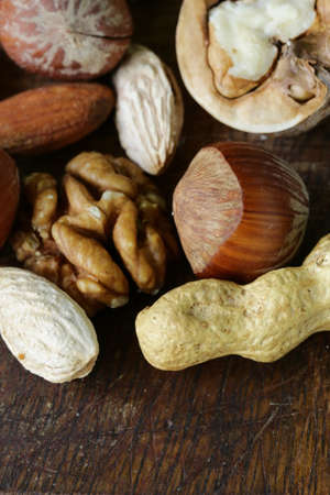Mix nuts on a wooden background macro shotの写真素材