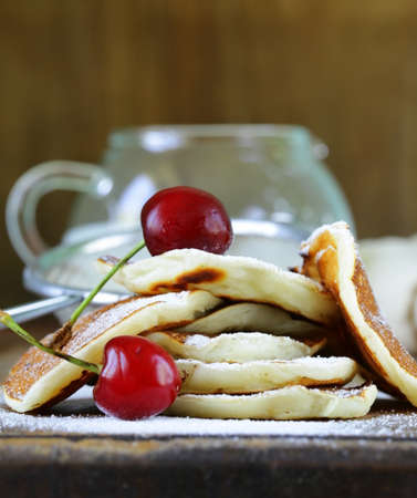 sweet dessert pancakes with powdered sugar for breakfastの写真素材