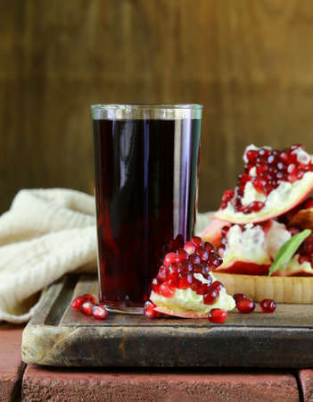 glass of fresh pomegranate juice from organic fruitsの写真素材