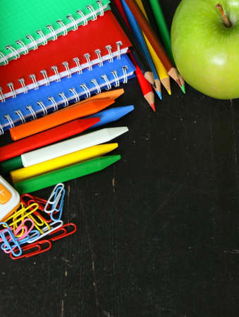 Back to school concept, school stationery multicolored pencils and notebooks