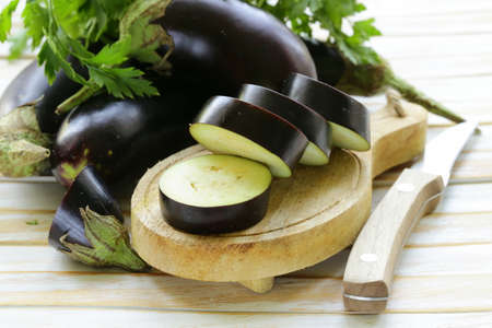 fresh ripe vegetables purple eggplant  on a wooden table