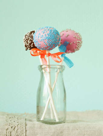 Variety of colorful cake pops - chocolate, vanilla and caramel flavorsの写真素材