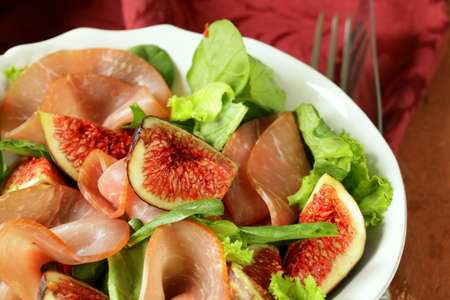 salad with smoked ham and fresh sweet figsの写真素材