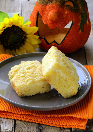 portion of cheesecake with orange flavor on the plateの写真素材