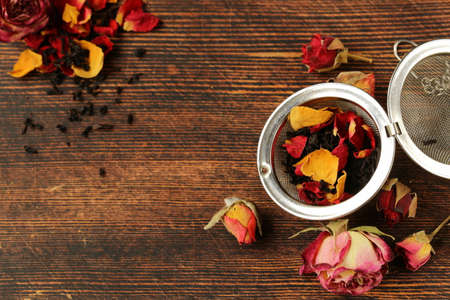 natural organic tea from dry roses on a wooden backgroundの写真素材