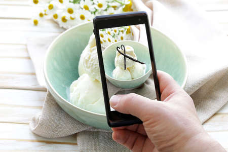 smartphone shot food photo -  vanilla ice cream with natural vanilla sticksの写真素材