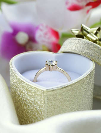 gold ring with diamond in a beautiful boxの写真素材
