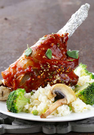 Meat shin baked with tomato sauce with vegetables garnishの写真素材