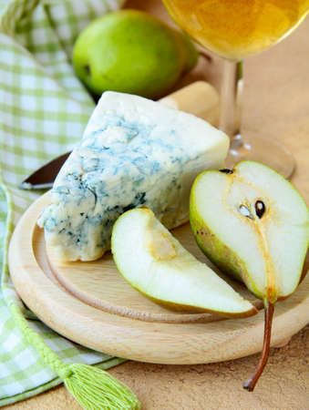 piece of blue cheese with fruits and herbsの写真素材