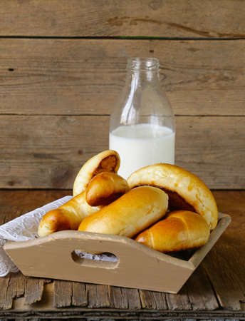 homemade pastries, sweet buns rolls with milkの写真素材