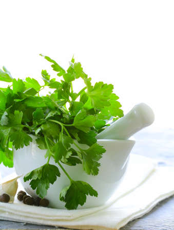 Fresh organic parsley in a marble mortarの写真素材