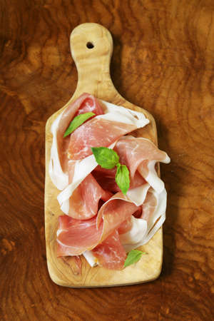parma ham (jamon) with fragrant herbs traditional Italian meat appetizerの写真素材