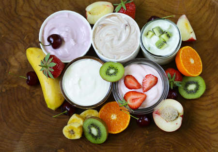 assortment of different yogurt for breakfast with berries and fruitsの写真素材