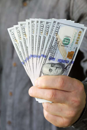 businessman hands holding dollar cash  business people finances and money conceptの写真素材
