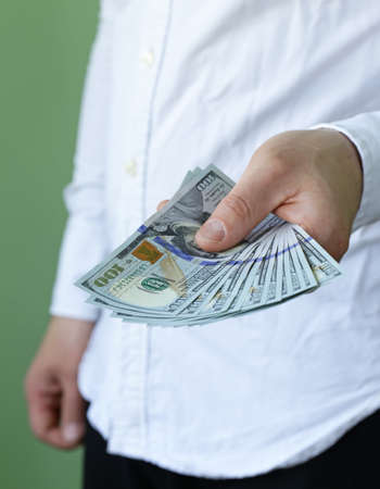 businessman hands holding dollar cash  business people finances and money conceptの写真素材