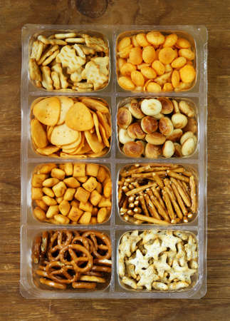 Various salty snacks  crackers chips nuts pretzelsの写真素材