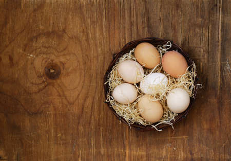 Farm natural organic eggs on a wooden background