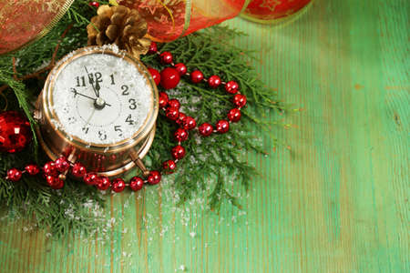 Christmas composition with fir branches, decorations and old clockの写真素材