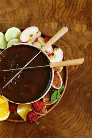 chocolate fondue with various fruits - easy and delicious dessertの写真素材