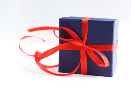 gift box with red ribbon on a white backgroundの写真素材