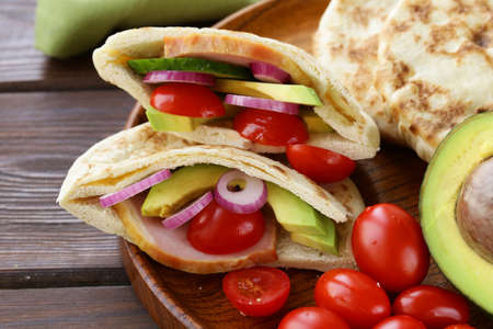 homemade tortillas pita stuffed with vegetables and meatの写真素材