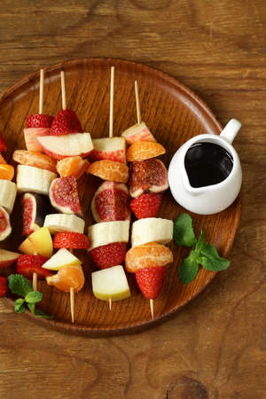 fruit on wooden skewers - dessert skewersの写真素材