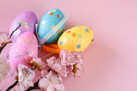 decorative colored eggs Easter symbol holiday on a pink background