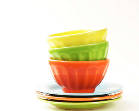 colorful bowls and plates on a white background