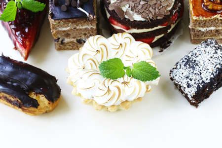 Assorted desserts, cakes and pastries on a white backgroundの写真素材
