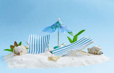 Travel vacation concept - sand island beach with sunbeds
