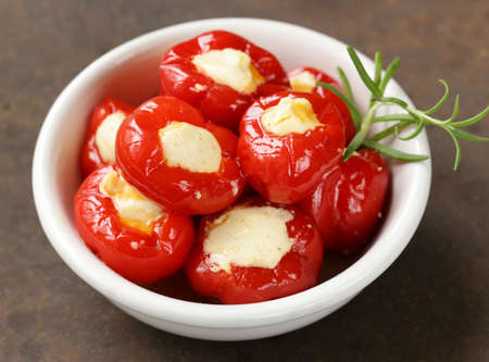 appetizer antipasti sweet peppers stuffed with soft cheeseの写真素材