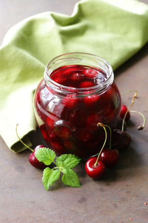 berry cherry compote canned in glass jarの写真素材