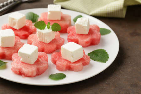 delicacy summer appetizer - sweet watermelon with salty soft cheeseの写真素材