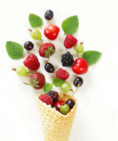 various fresh organic berries in waffle cone ice creamの写真素材