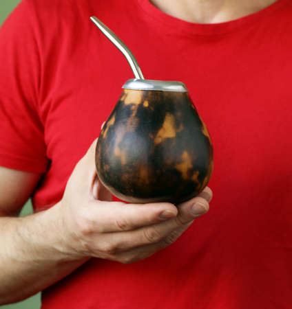 Traditional yerba mate tea in calabash mug and bombillaの写真素材