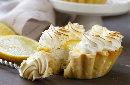 tartlet with lemon cream and meringue on a tableの写真素材