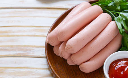 fresh homemade sausage on a wooden tableの写真素材