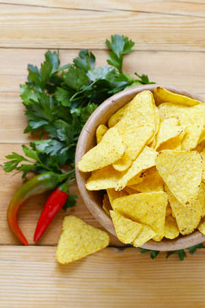 corn chips, nachos in a bowl on the table