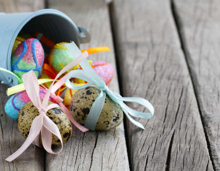 spring flowers and Easter eggs decoration on wooden backgroundの写真素材