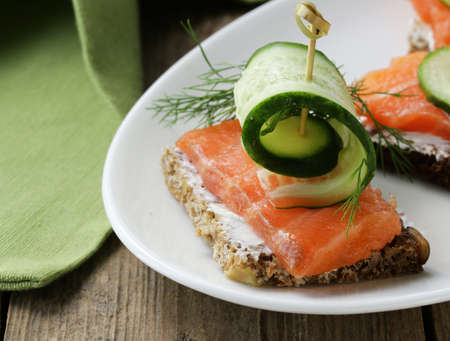 canape sandwiches with red fish, cucumber and soft cheeseの写真素材