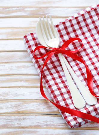 cutlery fork and spoon on a wooden backgroundの写真素材