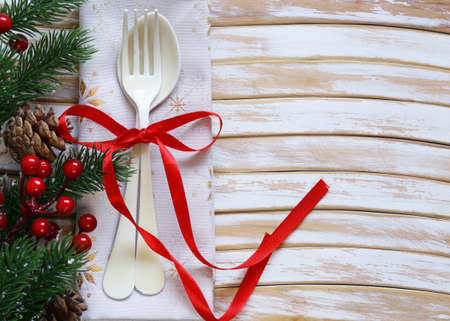 cutlery fork and spoon Christmas table setting on wooden backgroundの写真素材