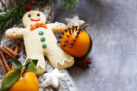 gingerbread man and Christmas decorations on wooden gray backgroundの写真素材