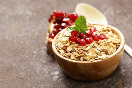 Natural wholegrain muesli with pomegranate for a healthy breakfastの写真素材