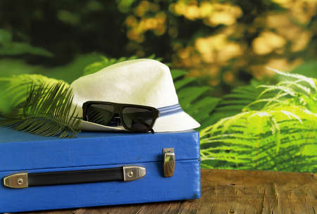 Vintage suitcase, hat, glasses - travel conceptの写真素材