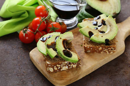 healthy eating - ripe avocado on a wooden boardの写真素材