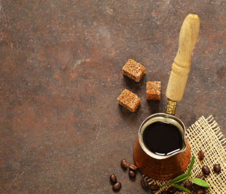 copper cezve coffee and grains on a steel backgroundの写真素材