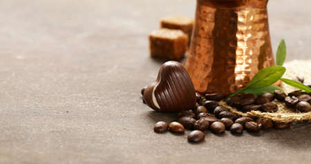 copper cezve coffee and grains on a steel backgroundの写真素材